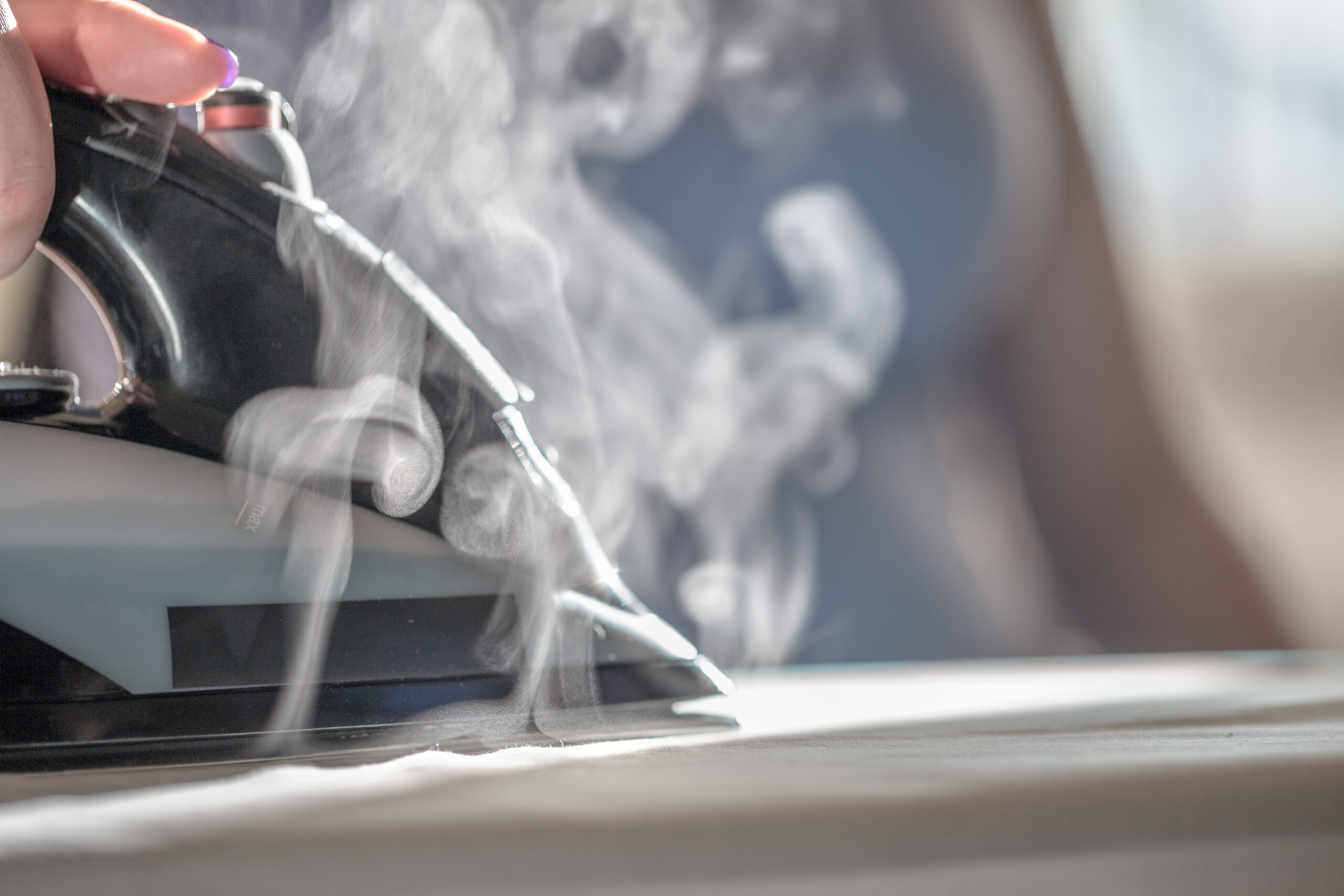 Iron,With,Steam,And,Water,Stream,Close-up.,Ironing,Clothes,On